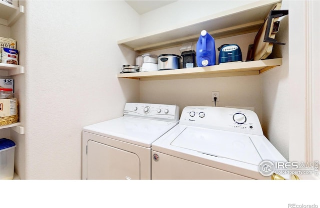 laundry room with washing machine and clothes dryer