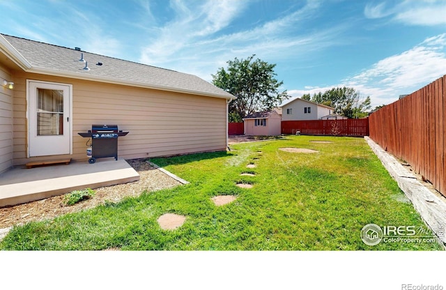 view of yard with a patio and an outdoor structure