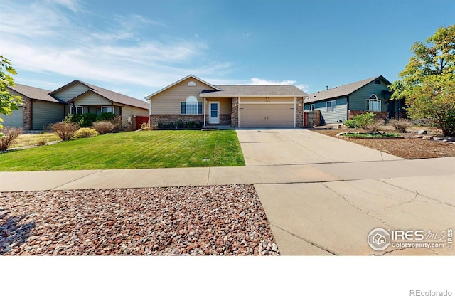 ranch-style house featuring a garage and a front yard