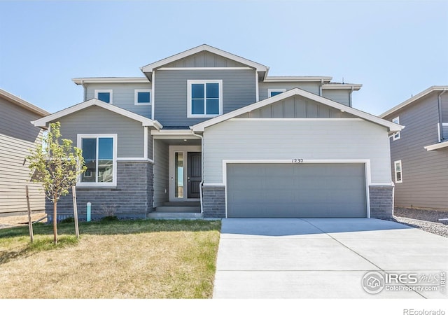 craftsman-style home with a garage and a front yard