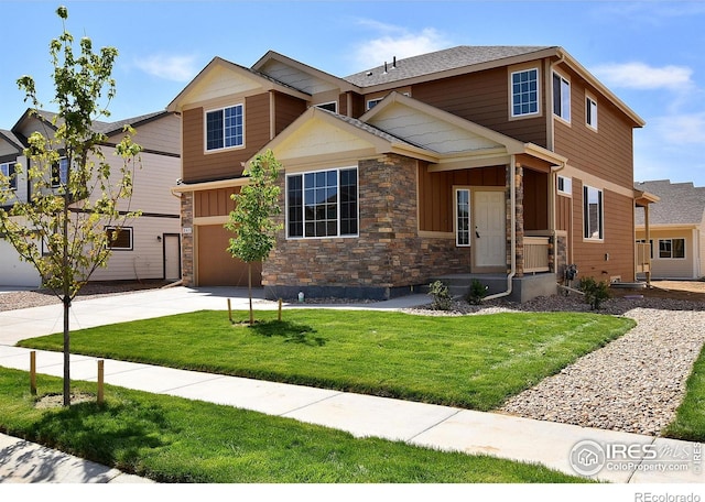 craftsman-style home with a front yard