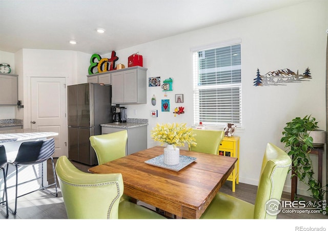 dining room with recessed lighting and baseboards