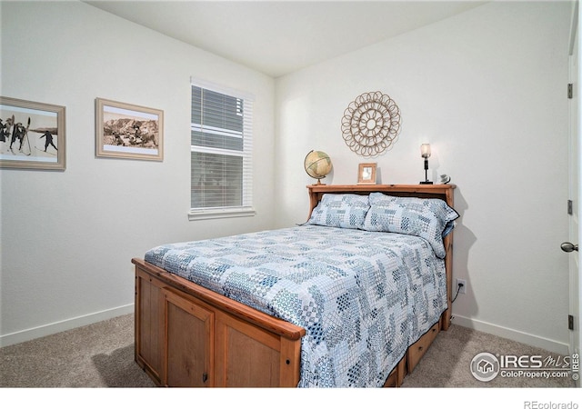 carpeted bedroom with baseboards