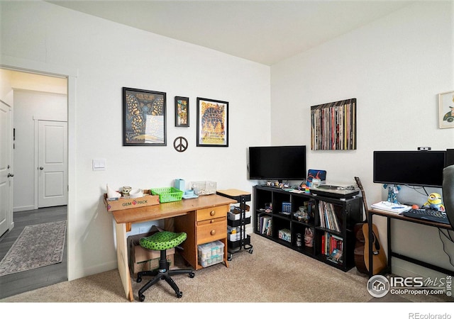 home office with baseboards and carpet floors