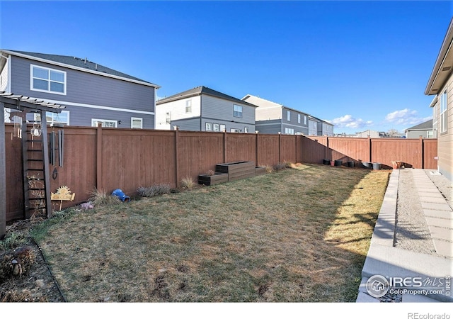 view of yard with a fenced backyard and a pergola