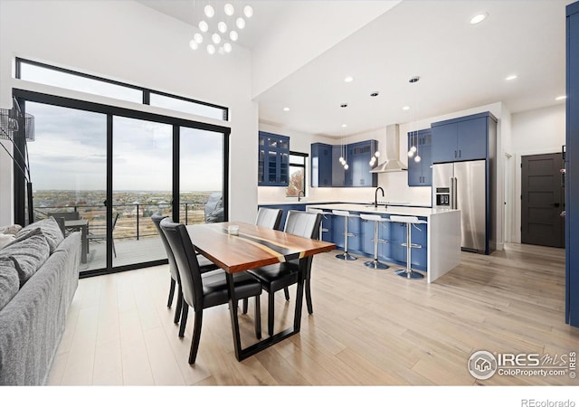 dining room featuring recessed lighting and light wood-style flooring