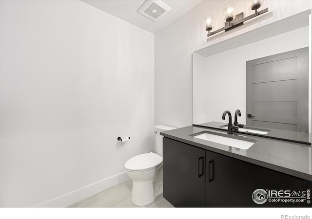 half bathroom featuring visible vents, baseboards, toilet, tile patterned floors, and vanity