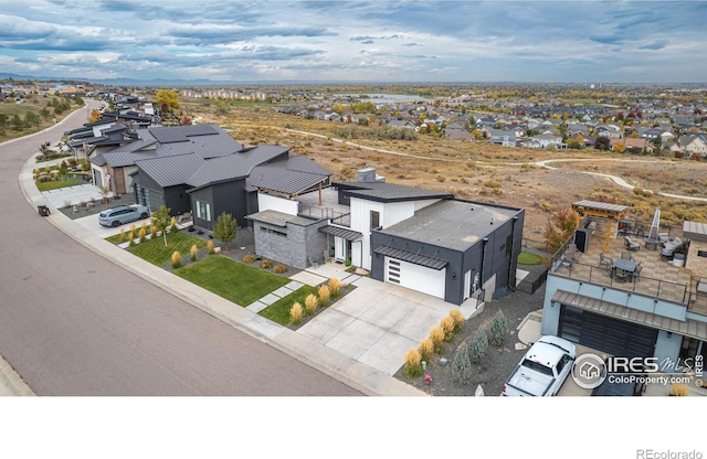 birds eye view of property with a residential view