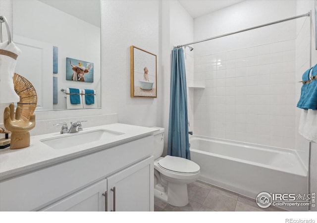 full bathroom with vanity, shower / tub combo with curtain, tile patterned floors, and toilet