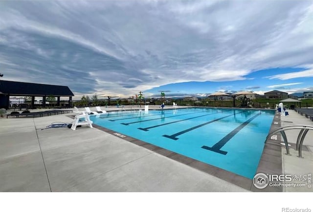 view of pool featuring a patio