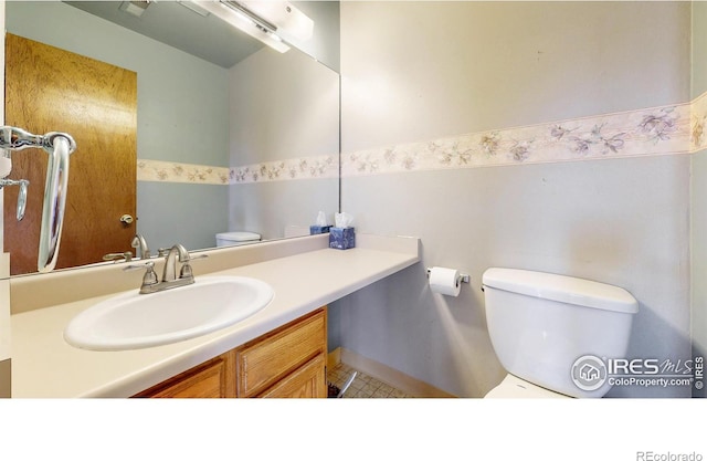 bathroom with vanity and toilet