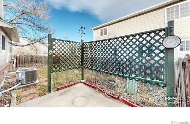 view of yard featuring cooling unit and a patio area