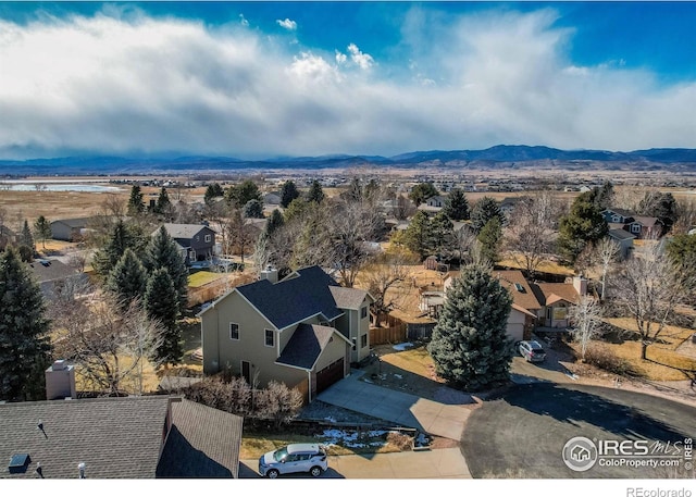 birds eye view of property featuring a mountain view