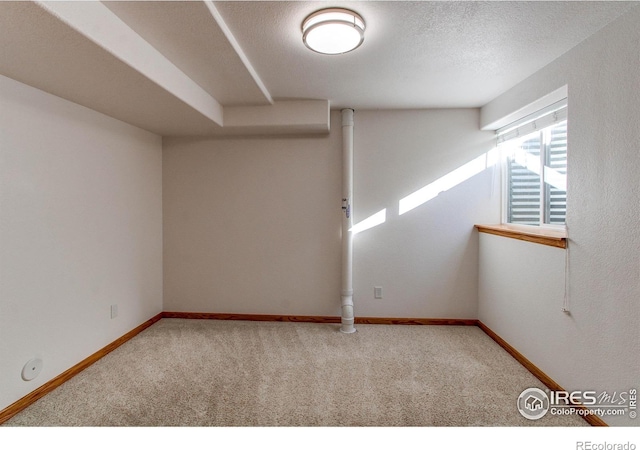 interior space with carpet and a textured ceiling