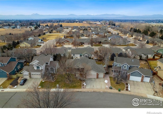 drone / aerial view featuring a mountain view