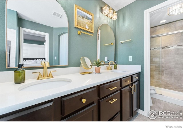 full bath with a stall shower, visible vents, a sink, and toilet