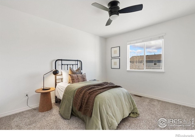 bedroom featuring carpet floors, visible vents, and baseboards