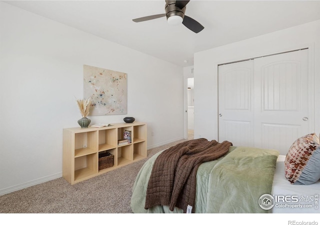 carpeted bedroom with a ceiling fan, baseboards, and a closet