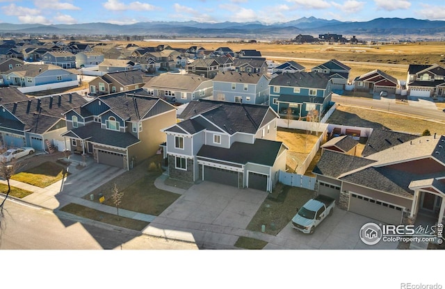 bird's eye view with a residential view and a mountain view