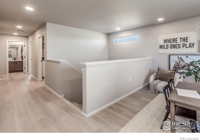 hallway with light wood-type flooring