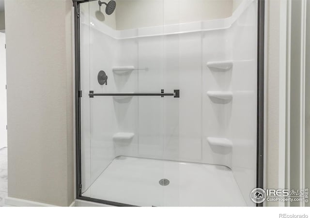 full bath featuring a stall shower