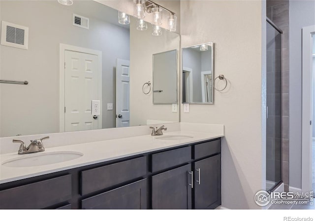 bathroom with an enclosed shower and vanity