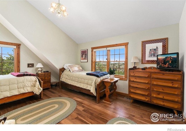 bedroom featuring lofted ceiling, a notable chandelier, and dark hardwood / wood-style flooring