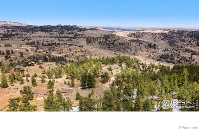 drone / aerial view featuring a mountain view