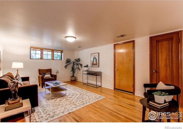 living room with light hardwood / wood-style floors