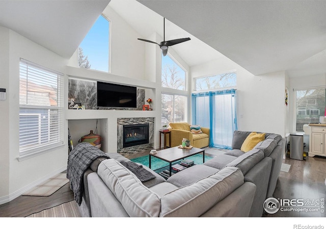 living room with ceiling fan, high vaulted ceiling, and hardwood / wood-style floors