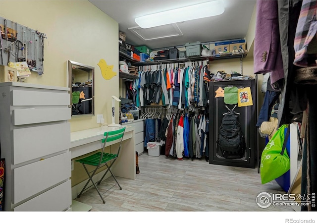 spacious closet featuring attic access and light wood-style flooring