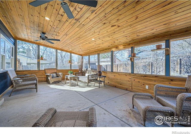 sunroom with wooden ceiling and a ceiling fan