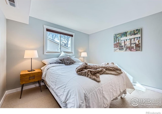 bedroom featuring visible vents, baseboards, and carpet flooring