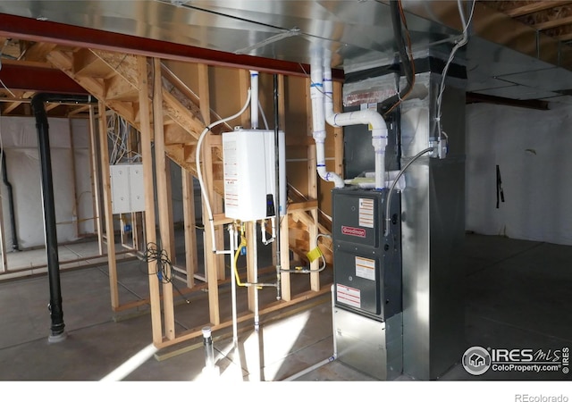 utility room featuring water heater