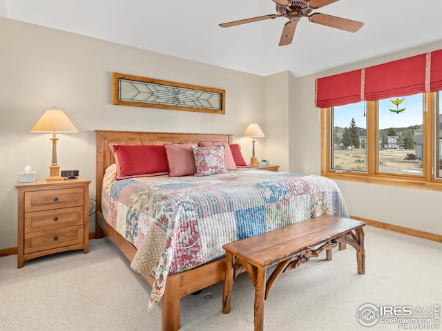 bedroom with light colored carpet and ceiling fan