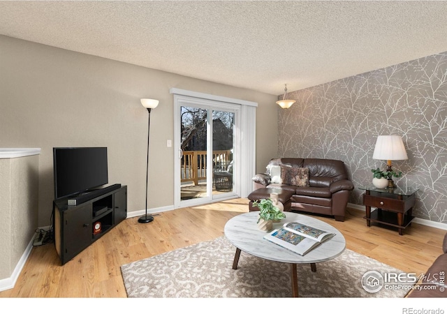 living room featuring hardwood / wood-style floors and a textured ceiling