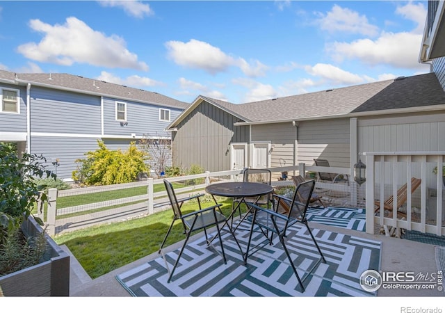 deck with a yard and a patio area