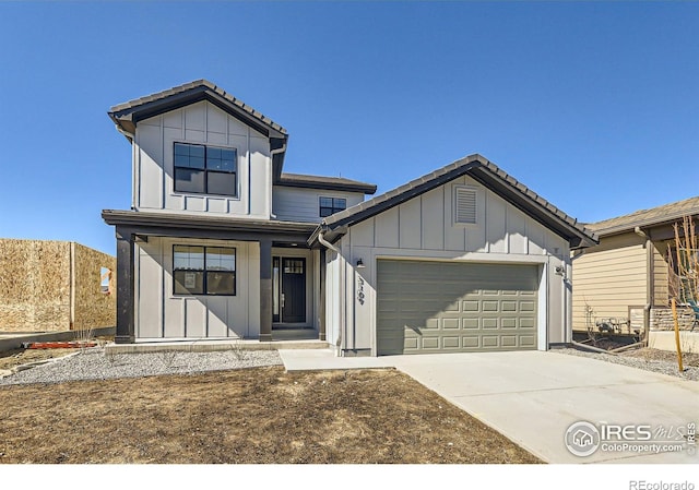 modern farmhouse with board and batten siding, concrete driveway, a tile roof, and an attached garage