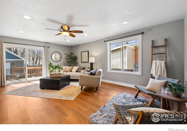 1005 Laporte Ave, Fort Collins, CO 80521 - living room featuring ceiling fan, plenty of natural light, light hardwood / wood-style floors, and a textured ceiling