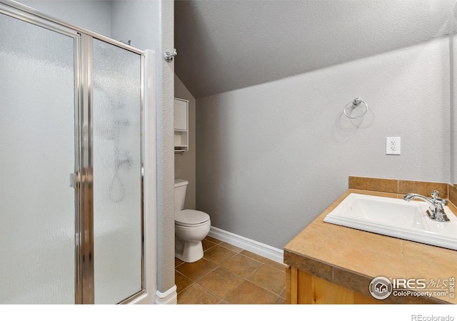 1005 Laporte Ave, Fort Collins, CO 80521 - bathroom with vanity, vaulted ceiling, tile patterned floors, toilet, and walk in shower