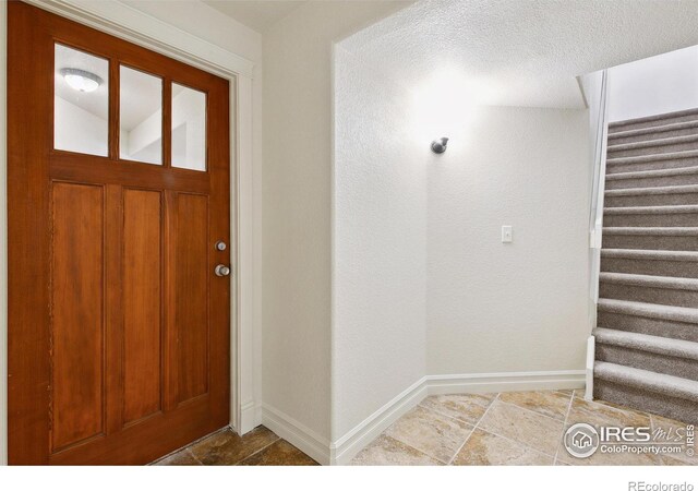 1005 Laporte Ave, Fort Collins, CO 80521 - foyer entrance featuring a textured ceiling