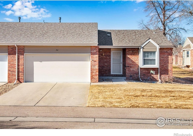 single story home with a garage and a front yard