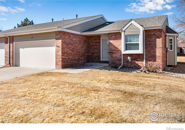 single story home with a garage and a front lawn