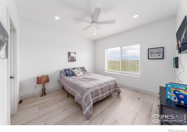 bedroom featuring ceiling fan and light hardwood / wood-style floors