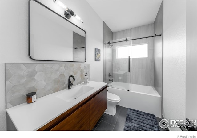 full bathroom with toilet, tasteful backsplash, shower / bath combination with glass door, vanity, and tile patterned flooring