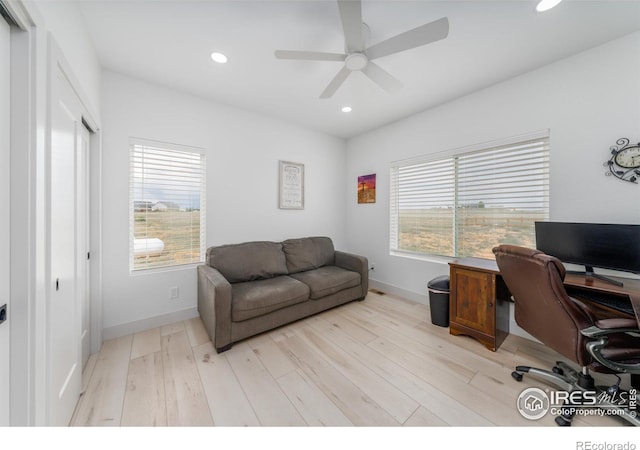 office featuring ceiling fan and light wood-type flooring