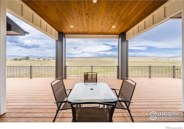 wooden terrace featuring a rural view