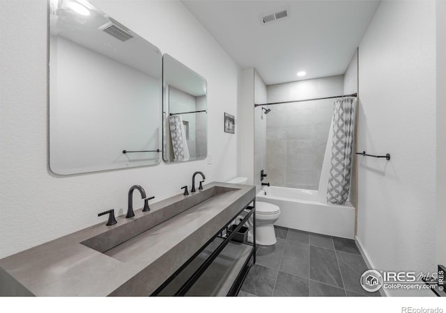 full bathroom with vanity, shower / tub combo, tile patterned floors, and toilet