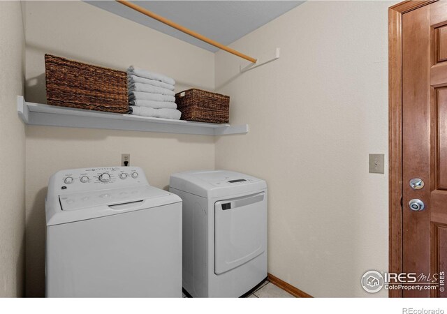 laundry room featuring separate washer and dryer