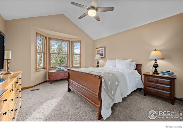 bedroom featuring carpet, vaulted ceiling, and ceiling fan